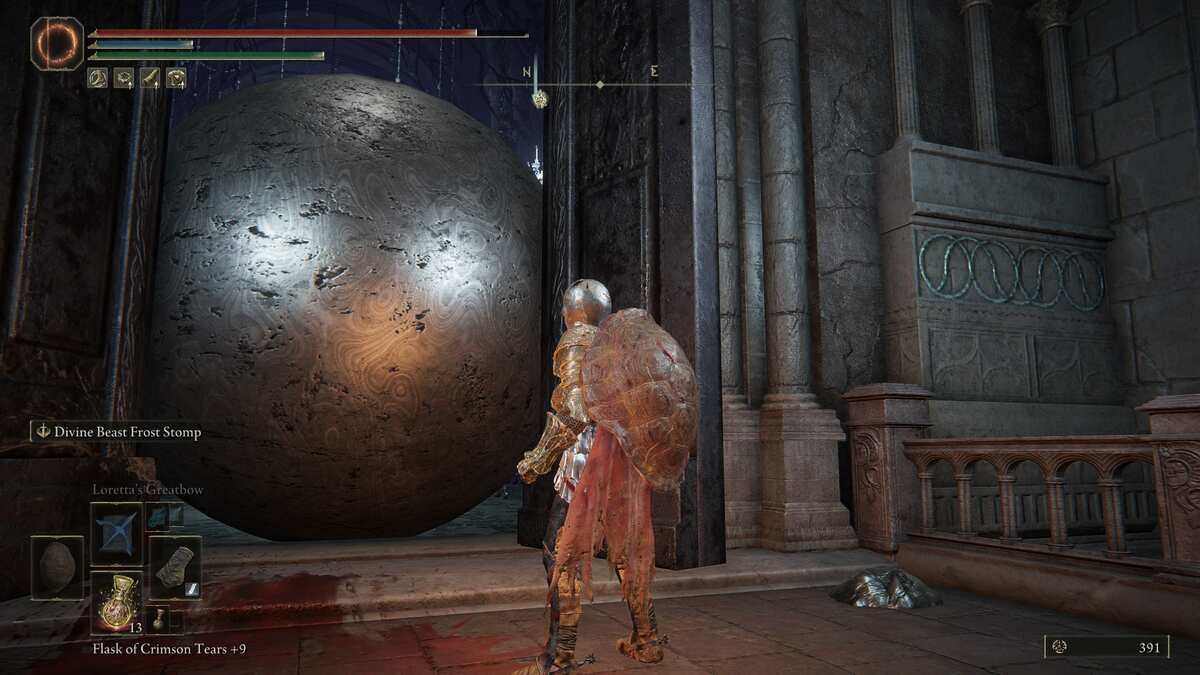 Elden Ring has perfected the disgusting little freak: A player stands next to a large open doorway with a giant sphere stuck in it.
