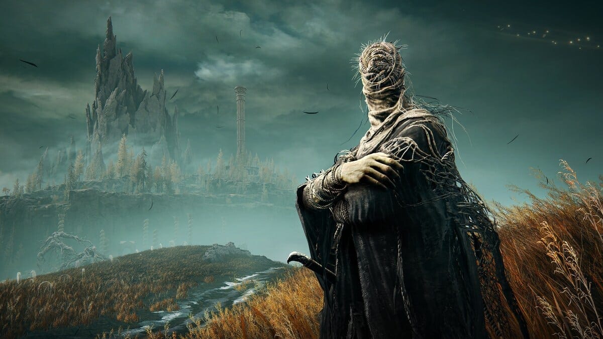 Elden Ring Shadow of the Erdtree preview: armoured figure stands in a desolate, foggy landscape with tall, jagged castle in the background.