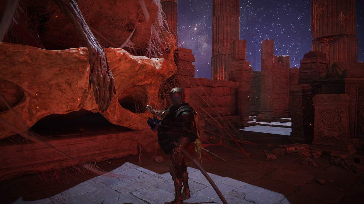 Shadow of the Erdtree Seamless Co-op: A player reaching out towards an arm sticking out from a cocoon at the Mohgwyn Palace.
