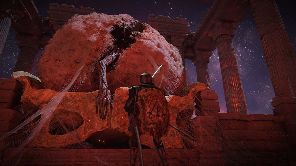 When is Shadow of the Erdtree set: A player standing next to the cocoon with Mohg's arm hanging out.