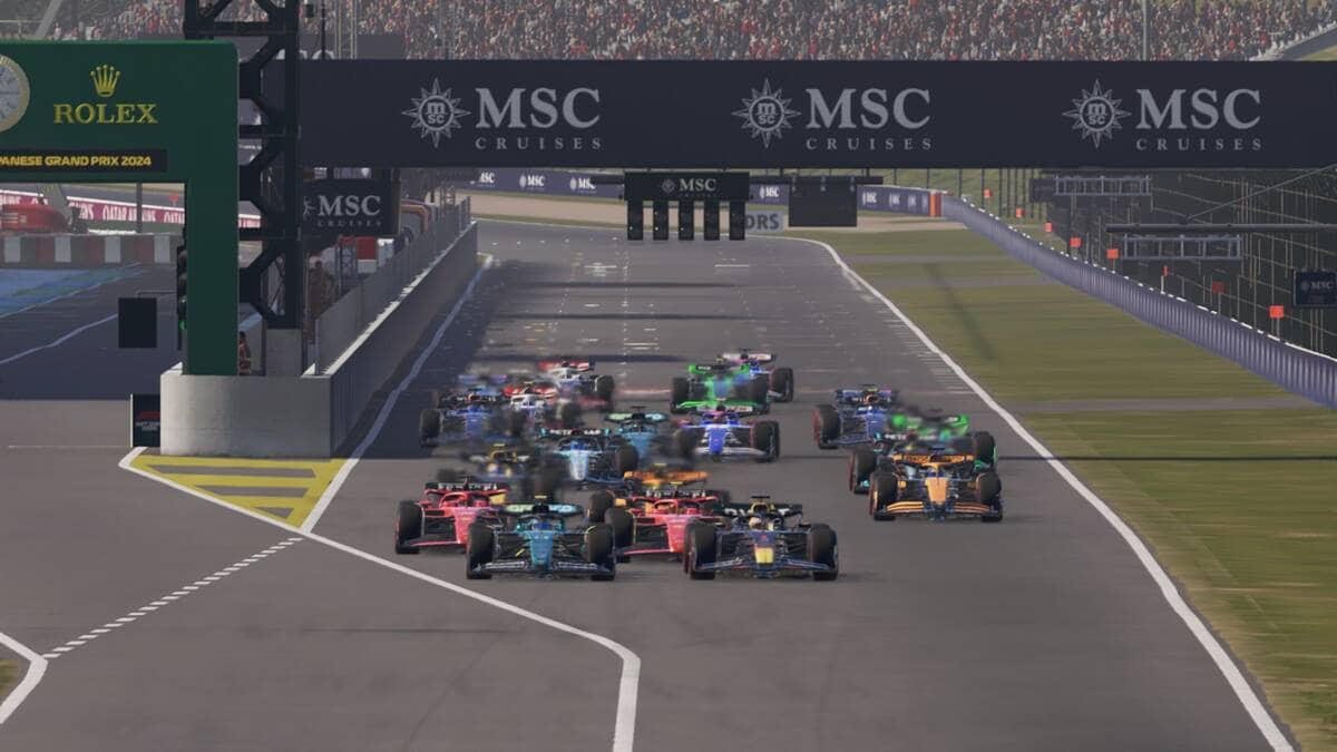 F1 24 review: A group of F1 cars beginning a race at the Japanese Grand Prix.