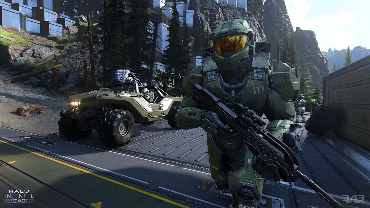 A player sprints past a Warthog vehicle with more players in Halo Infinite.