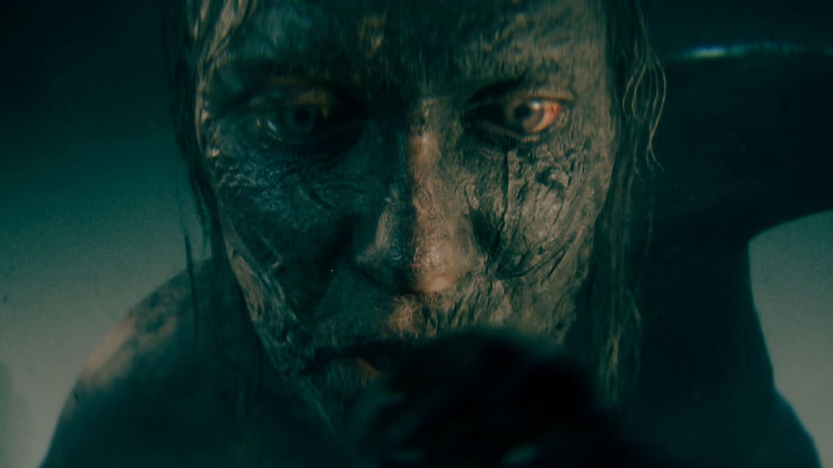 Hellblade 2 review: monster with blood shot eyes and wrinkly skin.