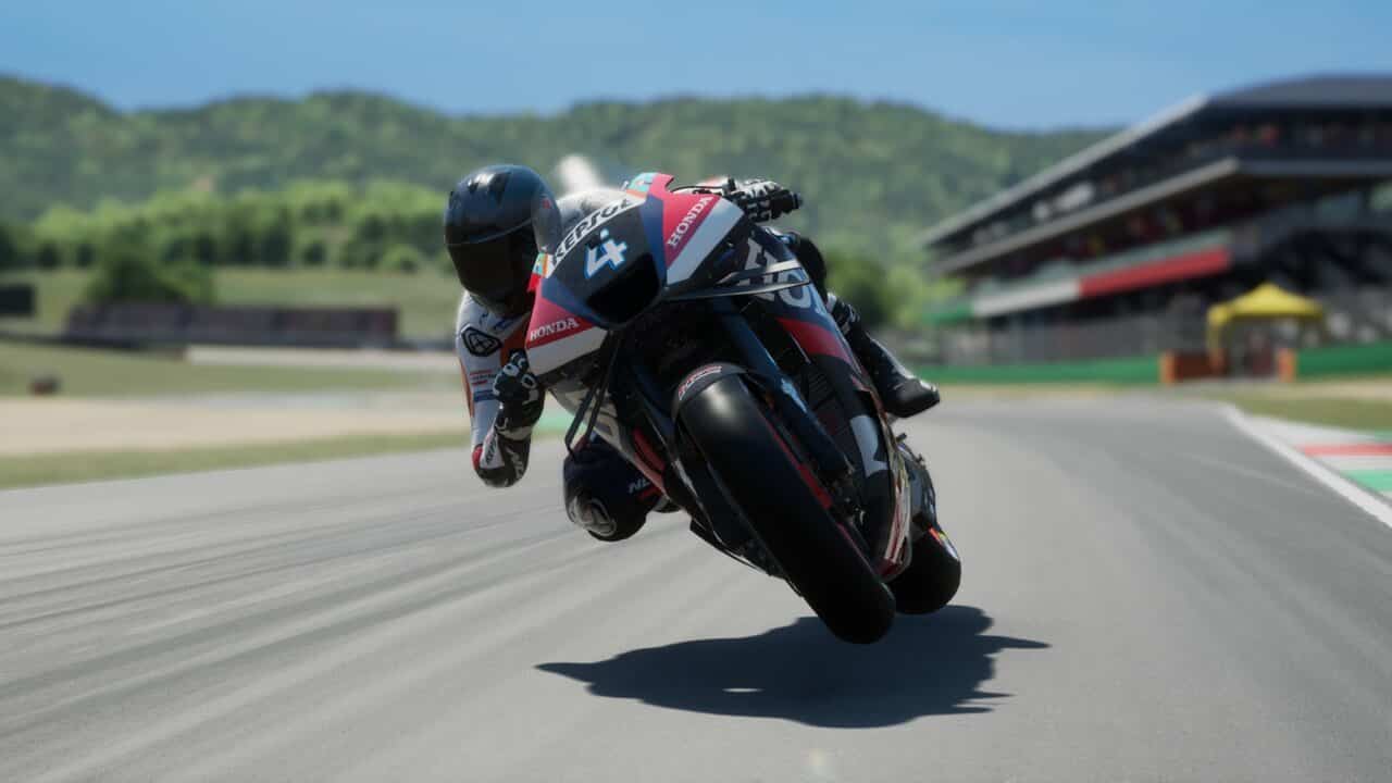 MotoGP 24 review: A close-up of a rider with their bike leaning to the left.