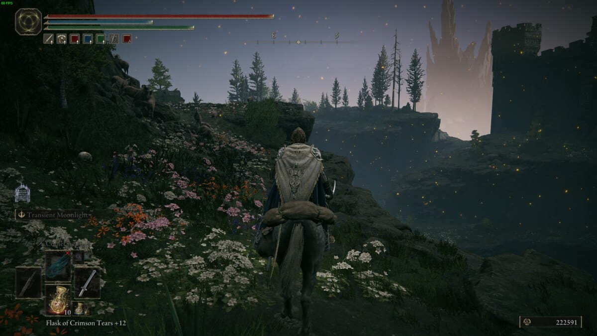 Elden Ring Shadow of the Erdtree review: Tarnished riding Torrent in hilly area with flowery fields.