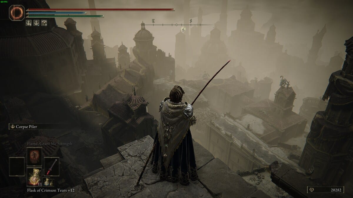 Elden Ring Shadow of the Erdtree review: Tarnished standing above the Belurat legacy dungeon.