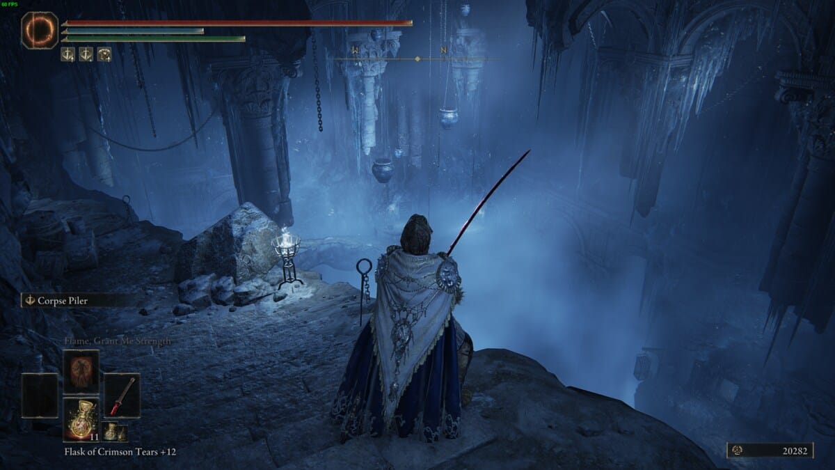 Elden Ring Shadow of the Erdtree review: Tarnished exploring a Gaol in Gravesite Plain.